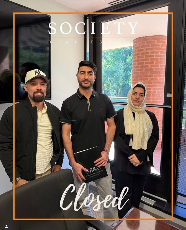 Brandon Lucas with clients after their closing
